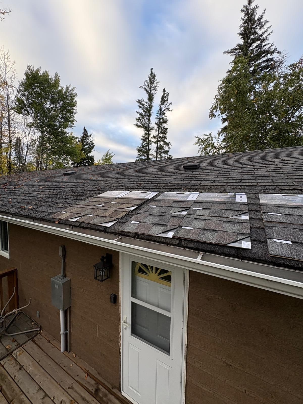 Finished roof under a clear Manitoba sky